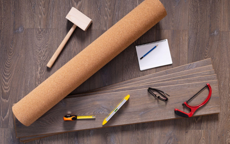Luxury Vinyl Tile (LVT) flooring and installation tools.