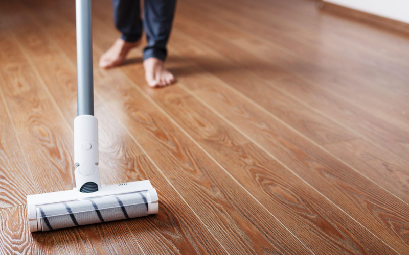 Turbo brush vacuum in use on household flooring.
