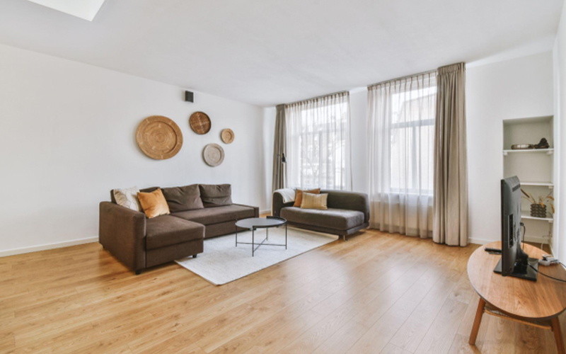 Modern living room featuring wood-look resilient flooring