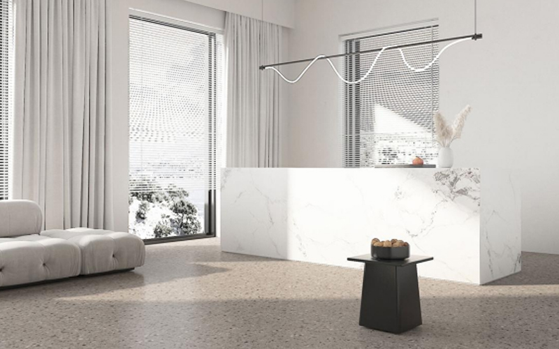A modern living room with LVT flooring and minimalist furniture.