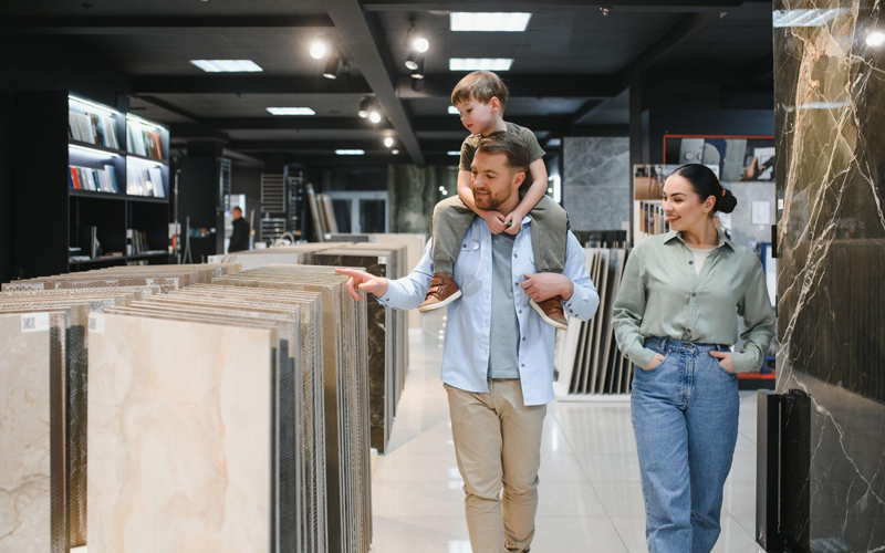 Family choosing ceramic tiles in a flooring store