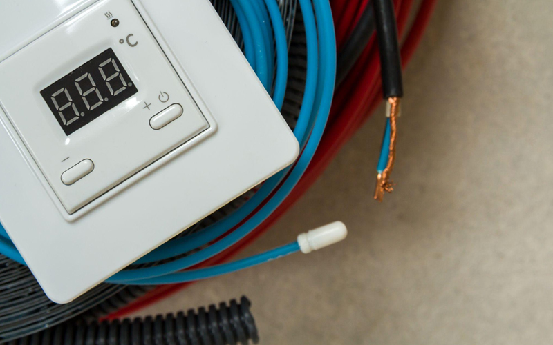 Heating floor system wires, cables, and control panel.